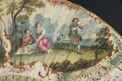 null Picnic, circa 1720
Folded fan, the leaf in skin, mounted in English style, and...