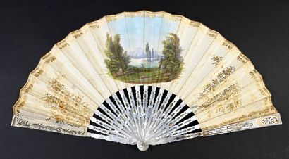null In front of the fireplace, circa 1830-1840
Folded fan, the leaf made of engraved...