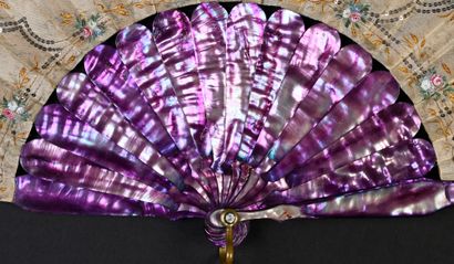 null Violet mother-of-pearl, circa 1900
Folded fan, the cream silk leaf painted with...