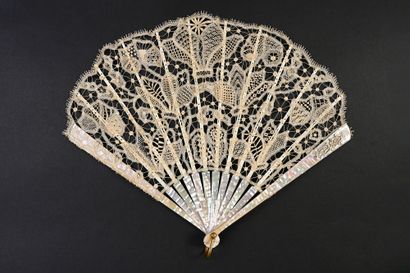 null Cyclamen, circa 1900
Folded fan, balloon shape, in lace. Each petal has different...