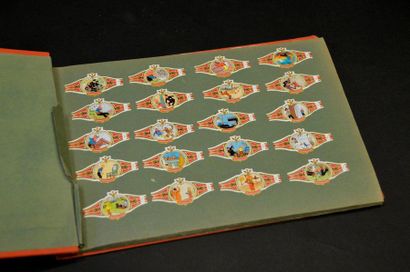HERGÉ. LES BAGUES À CIGARES TINTIN Tintin. Album horizontal orange, avec scènes de...