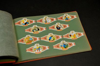 HERGÉ. LES BAGUES À CIGARES TINTIN Tintin. Album horizontal orange, avec scènes de...