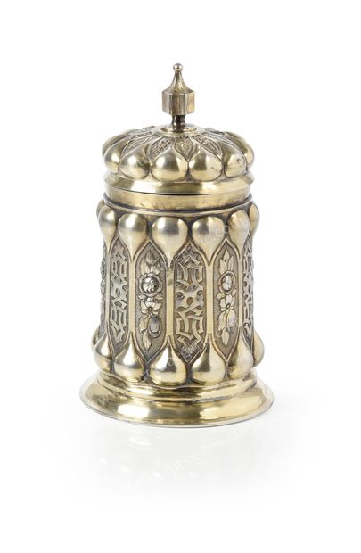  LARGE SILVER COVERED GOBELET. Cylindrical form, with embossed decoration of stylized...