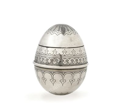 null SILVER EGG.
With chased decoration of stylized friezes, the upper part is removable,...