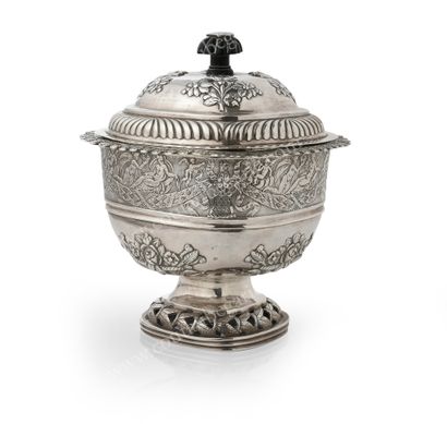 null SILVER COVERED SUCRIER.
Of square form, with carved ebony grip, with embossed...