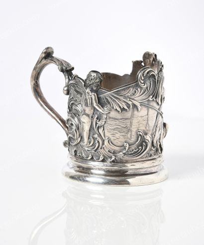  SILVER TEA HOLDER. By FABERGÉ, Moscow, 1895. Decorated with a romantic scene of...