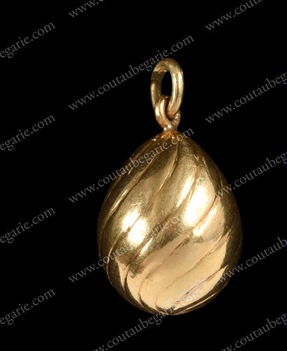 SMALL MINIATURE EGG PENDANT. 
 In gold with...