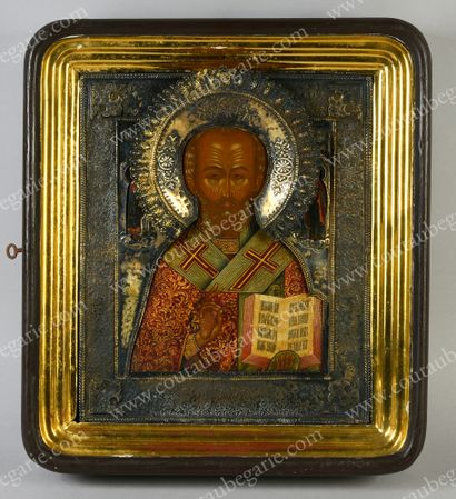 null SAINT NICOLAS. 
 Russian icon, tempera on wood, preserved under a gilt riza,...