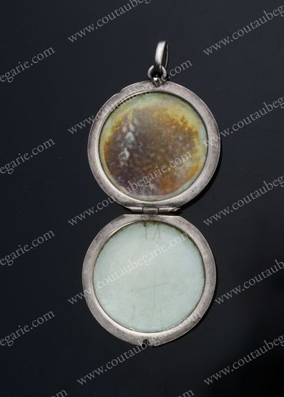 null SILVER PENDANT MEDAL.
Of round shape, with enamelled translucent blue decoration...