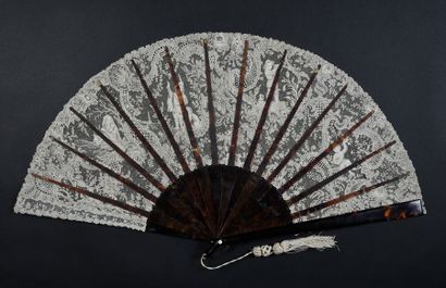 null Rare large folded "Four Seasons" Point de Gaze fan, circa 1880-1900.
The extremely...