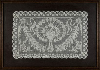 null Mechelen lace with peacock, spindles, early 20th century.
Small panel decorated...