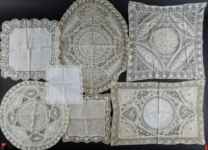 null Meeting of doilies and handkerchiefs, early 20th century.
Four placemats with...