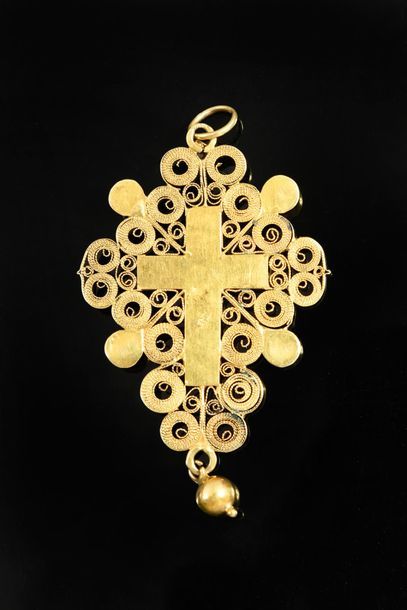 null CROSS PENDANT IN YELLOW GOLD.
Representing Christ on his cross applied on a...