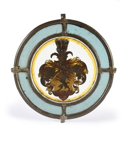 null VITRAIL RONDELLE EN GRISAILLE.
À décor polychrome, représentant un blason sur...