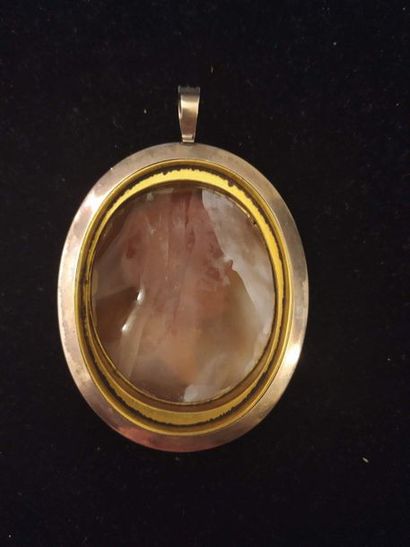 null LARGE MEDALLION PENDANT.
Oval in shape, decorated in the centre with a carved...
