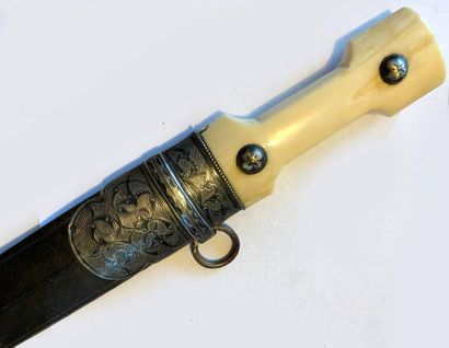 null * KINDJAL - CAUCASIAN DAGGER.
Walrus ivory handle with two niello silver knobs,...