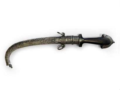 null * MAGHREB DAGGER.
Ebony handle, curved blade, silver scabbard decorated with...