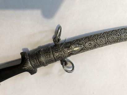 null * MAGHREB DAGGER.
Ebony handle, curved blade, silver scabbard decorated with...