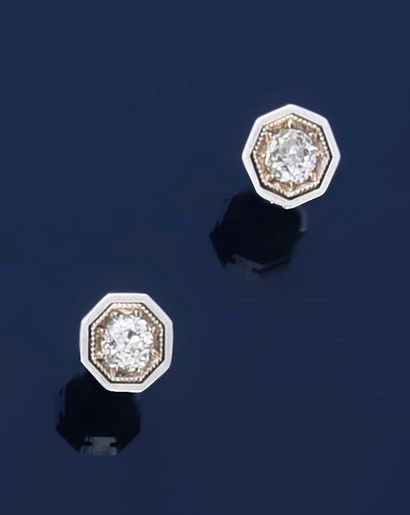 null Pair of ear studs in 750° gold set with an antique cut diamond in an octagonal...