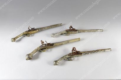 null OTTOMAN SILEX GUN.
In chased and niello silver with scrolls and trophies decoration....