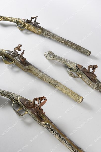 null OTTOMAN SILEX PISTOL.
In silver and vermeil with chiselled decoration of scrolls,...