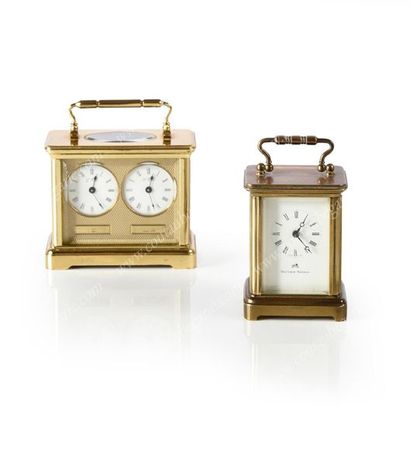 null TRAVEL OFFICER'S CLOCK. 
 In gilded metal, white enamel dial, Roman numerals....