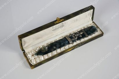 null *PAPER CUTTER. 
 Rectangular shape carved in a block of foam agate. Silver plated...
