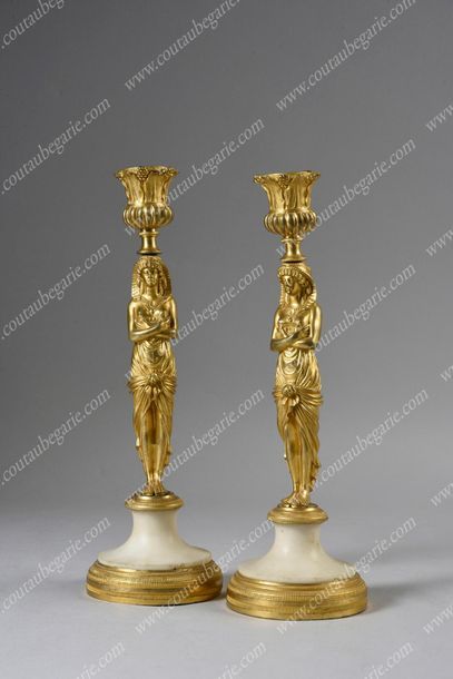 null *CARIBBON WOOD PEAR.
With caryatid decoration draped in gilt bronze resting...