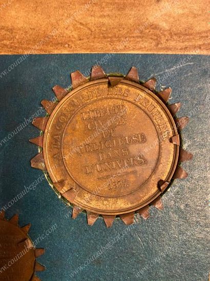 null FRAMEWORK.
Containing five commemorative bronze medals with a brown patina,...