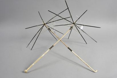 null Two marquise umbrella frames, Second Empire, the handles, pommels and tips in...
