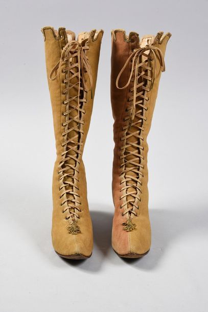 null Pair of lace-up boots, late 19th century, high 
boots with stitched pointed...