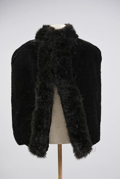 null Two short capes, late 19th century, both in black velvet edged with ostrich...