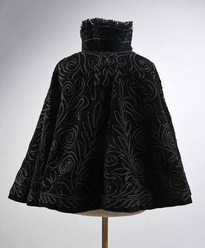null Two short capes, late 19th century, both in black velvet edged with ostrich...