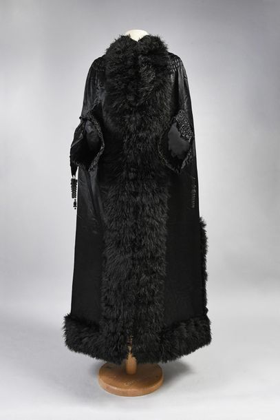 null Evening coat, circa 1890, black silk satin mid-length coat with hook and loop...