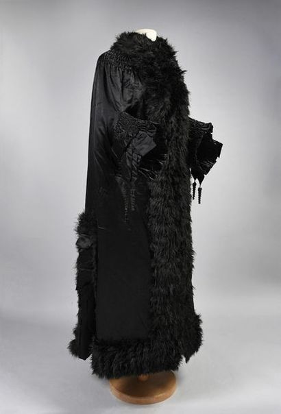 null Evening coat, circa 1890, black silk satin mid-length coat with hook and loop...