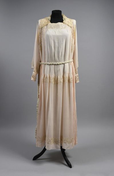 null Dress circa 1920, long sleeved pagoda dress tightened at the wrist, in pale...