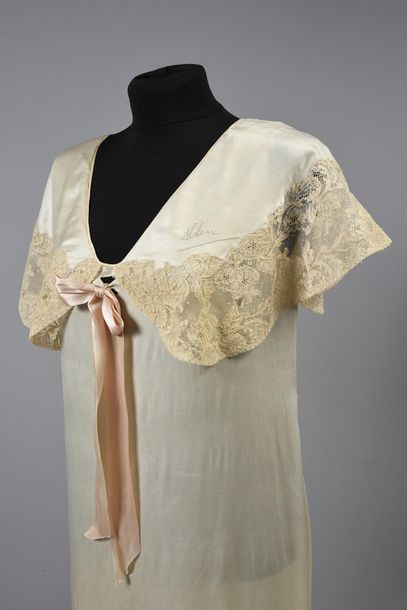 null Two nightdresses around 1930, one in ivory silk satin with a large collar bordered...