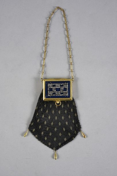 null Minaudière, circa 1910, black and gold steel mesh pocket with three falling...
