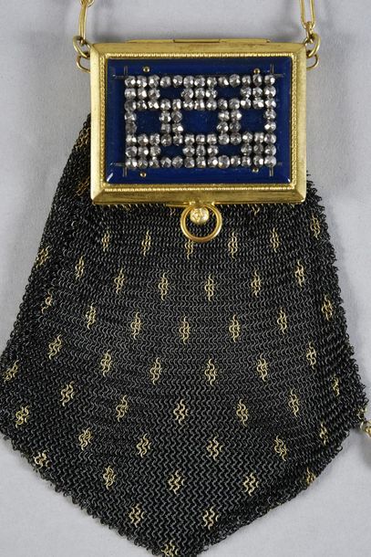 null Minaudière, circa 1910, black and gold steel mesh pocket with three falling...