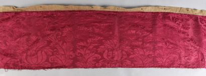 null Crimson damask bedspread, circa 1700, decorated with a finial inscribed between...