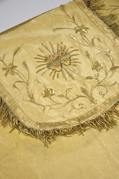 null Early 20th century, gold cloth cope; orphreys embroidered in gold guipure with...
