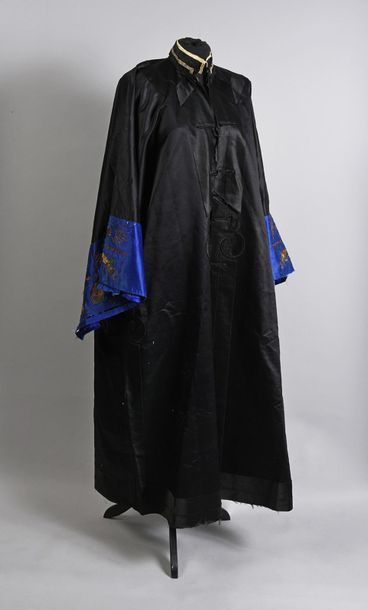 null Man's coat, China, early 20th century, black satin coat; finely embroidered...