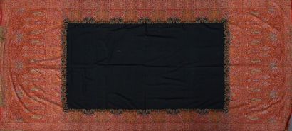null Long cashmere shawl, circa 1840, plain black field in a frame of palmettes alternating...
