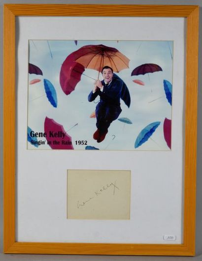 null KELLY Gene (1912-1996).

Autograph signed "Gene Kelly" accompanied by a colour...