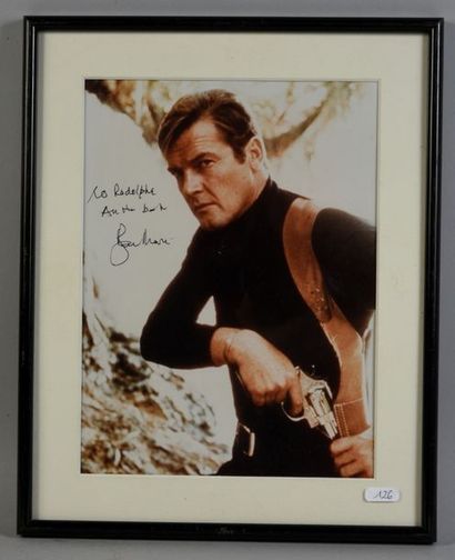 null MOORE Roger (1927-2017).

Modern colour photograph of the actor, with autograph...