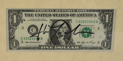 null TRAVOLTA John (°1954).

One-dollar bill bearing the actor's autograph signature,...