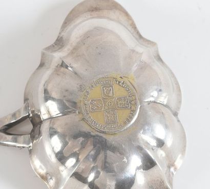 null SILVER SERVICE LADLE.

With embossed and chiselled decoration of a garland of...