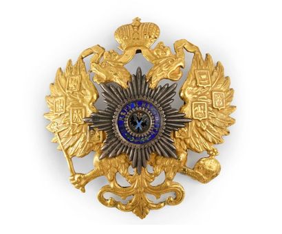 null COIFFE ELEMENT (Russia).

In gilded metal repoussé applied in the centre of...