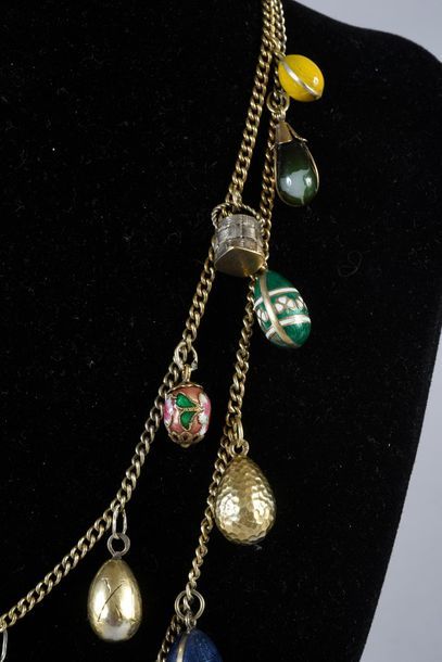 null SET OF TWO VERMEIL CHAINS ORNAMENTALED WITH 22 MINIATURE EGGS PENDING, some...
