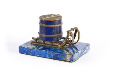 null CLIPBOARD.
Decorated with a sled carrying a gilt bronze tub resting on a rectangular...